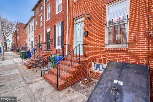 entrance to property with brick siding