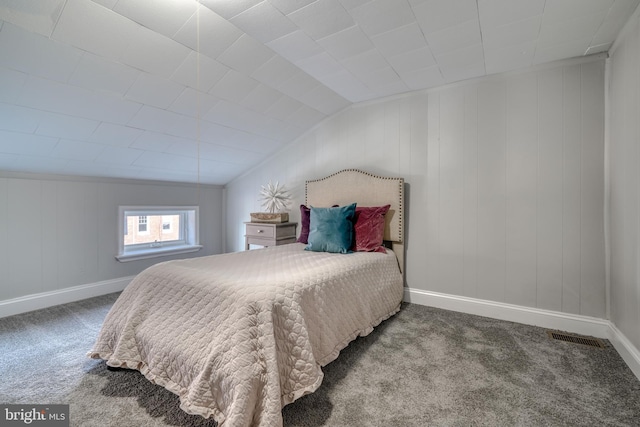 bedroom with carpet flooring, vaulted ceiling, visible vents, and baseboards