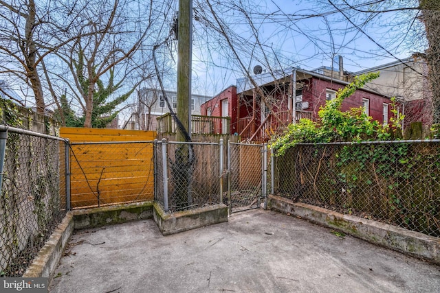 exterior space featuring fence and a gate