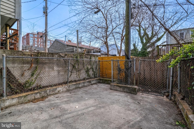 view of patio / terrace featuring a fenced backyard and a gate