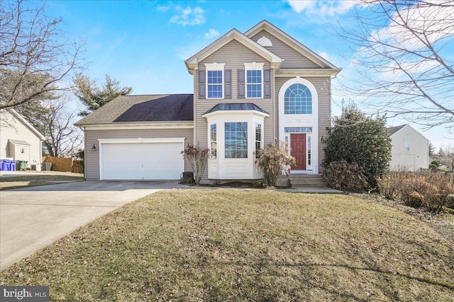 traditional-style home featuring concrete driveway, a front lawn, and an attached garage