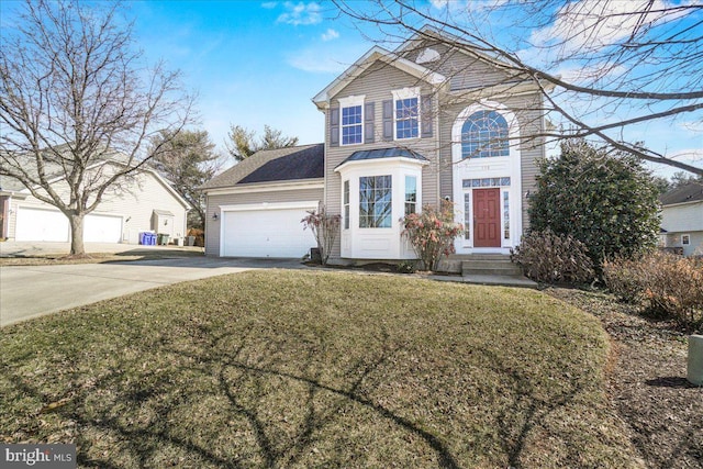 traditional-style home with driveway, a garage, and a front lawn