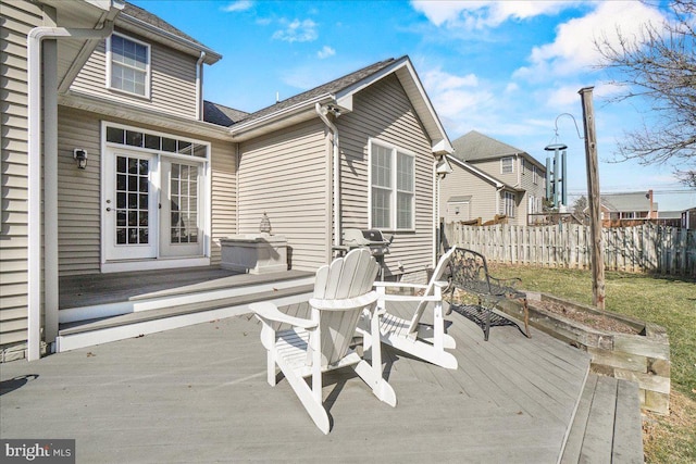 wooden terrace featuring fence