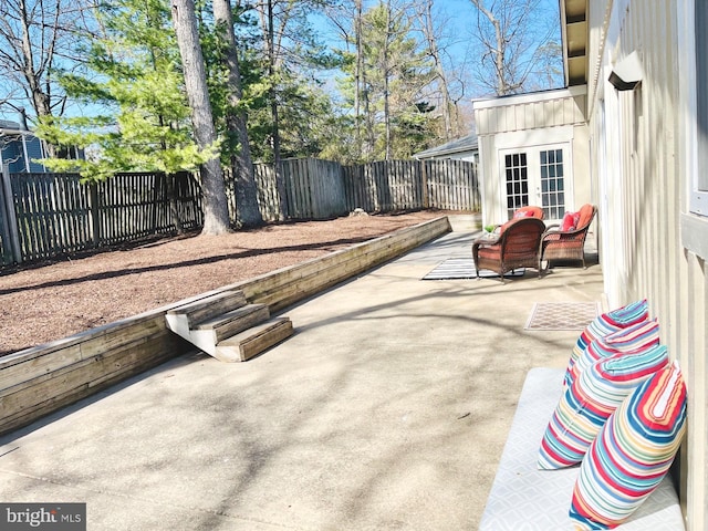 view of patio / terrace with french doors and a fenced backyard