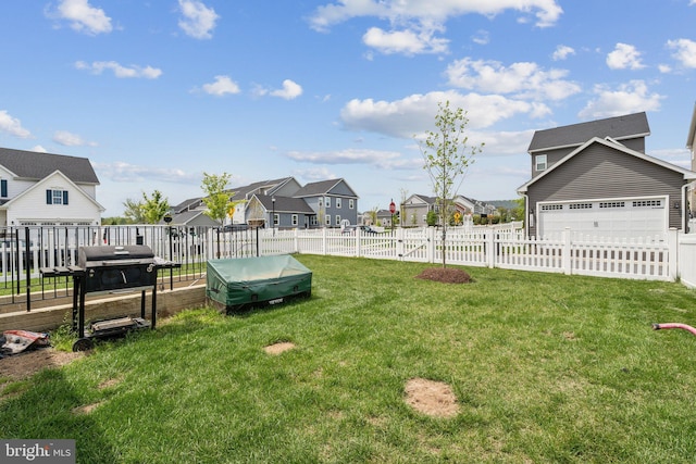 view of yard with a residential view and fence