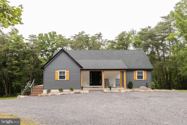 view of front of home featuring a shingled roof