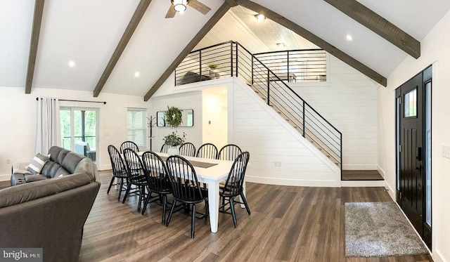 dining space with dark wood-style floors, beam ceiling, baseboards, and stairs