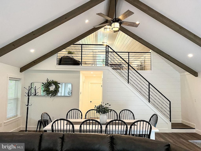 dining space with high vaulted ceiling, dark wood-style flooring, a ceiling fan, baseboards, and beam ceiling