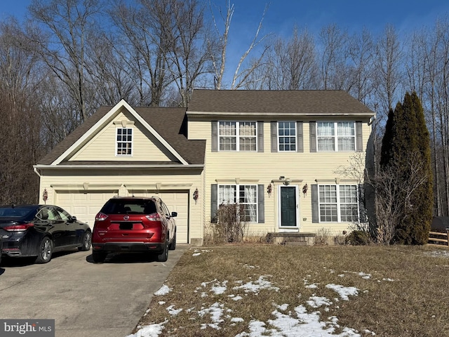 colonial home featuring concrete driveway