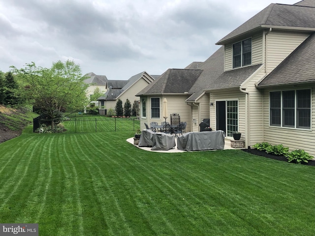 view of yard featuring a patio area and fence