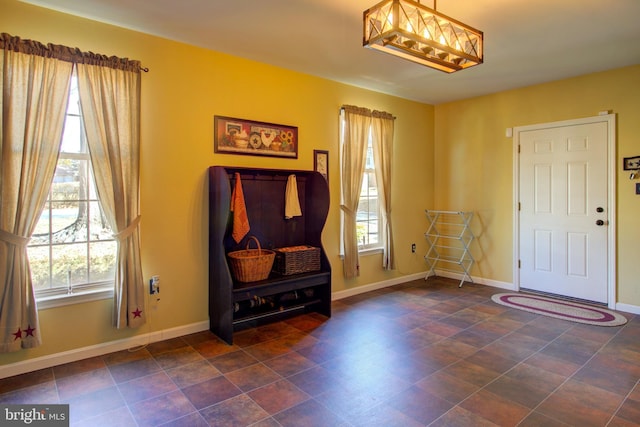 entryway featuring baseboards