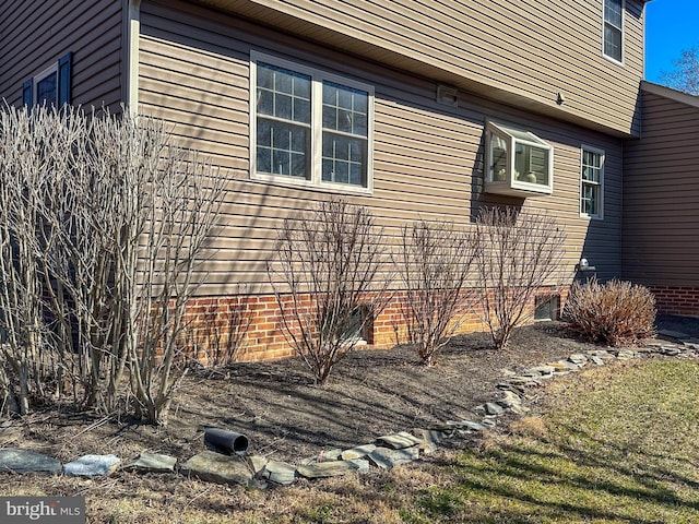 view of property exterior with crawl space