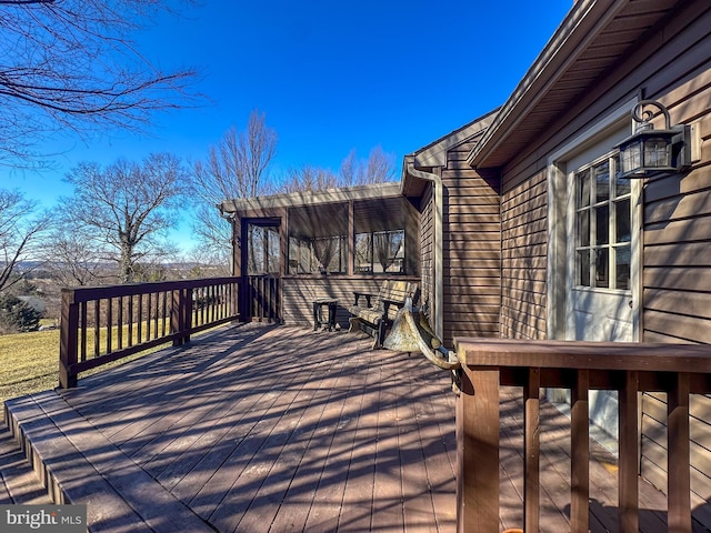 deck with a sunroom