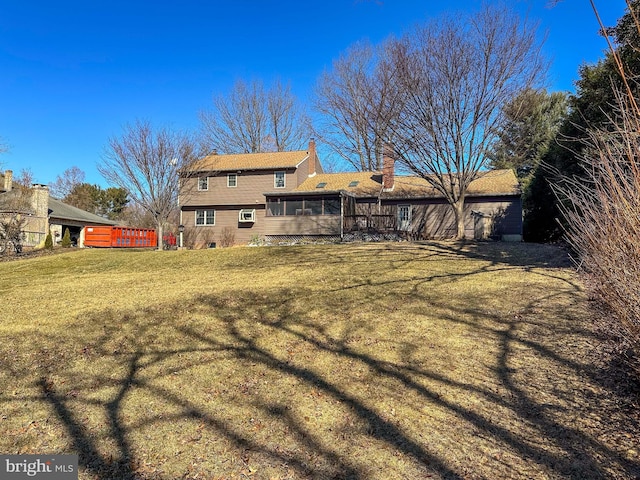 view of yard with a sunroom