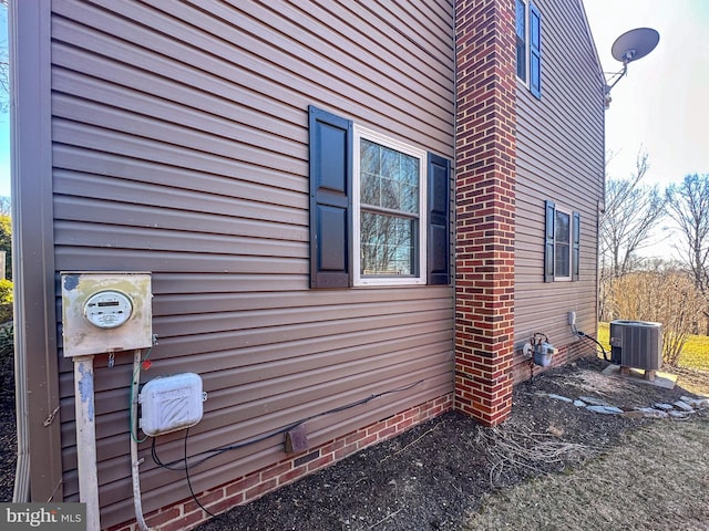 view of side of property with central AC unit