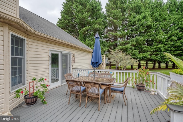 deck with outdoor dining area