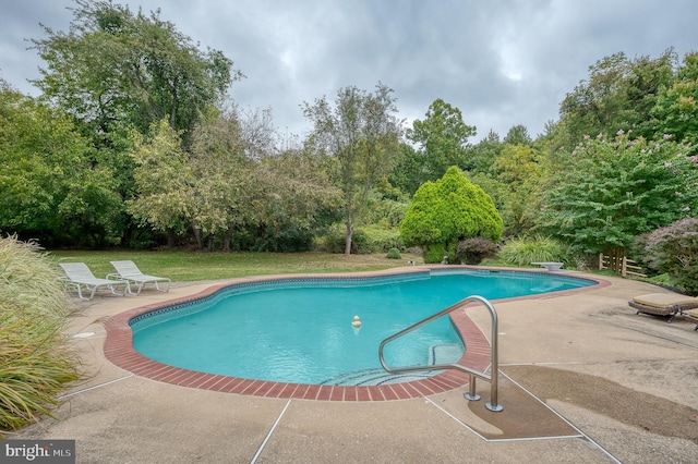 outdoor pool featuring a patio