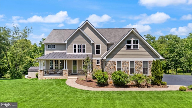 36976 Walnut Park Ln, Purcellville, VA 20132 - craftsman inspired home featuring covered porch, a front yard, stone siding, a standing seam roof, and metal roof