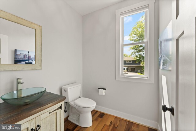 36976 Walnut Park Ln, Purcellville, VA 20132 - half bath with baseboards, vanity, wood finished floors, and toilet