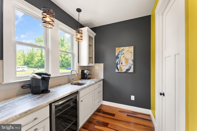 36976 Walnut Park Ln, Purcellville, VA 20132 - kitchen with beverage cooler, a sink, white cabinets, and wood finished floors