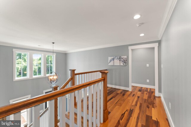 36976 Walnut Park Ln, Purcellville, VA 20132 - hallway featuring an upstairs landing, crown molding, a chandelier, wood finished floors, and baseboards