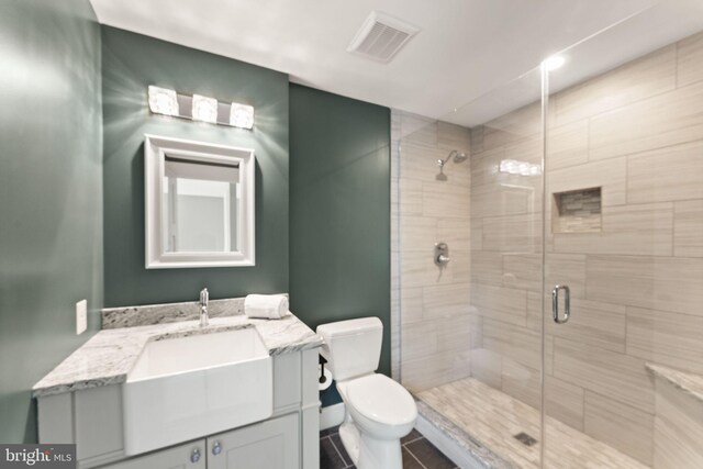 36976 Walnut Park Ln, Purcellville, VA 20132 - bathroom with toilet, vanity, a stall shower, and tile patterned flooring