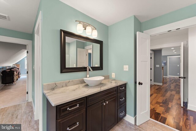 36976 Walnut Park Ln, Purcellville, VA 20132 - bathroom with wood finished floors, vanity, and baseboards