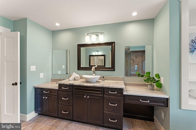 36976 Walnut Park Ln, Purcellville, VA 20132 - bathroom featuring wood finished floors, vanity, baseboards, and recessed lighting