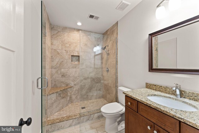 36976 Walnut Park Ln, Purcellville, VA 20132 - bathroom with a shower stall, vanity, toilet, and recessed lighting