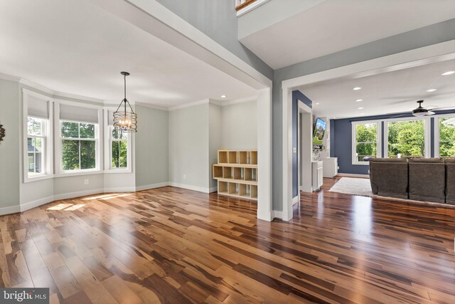 36976 Walnut Park Ln, Purcellville, VA 20132 - empty room with wood-type flooring, a chandelier, baseboards, ornamental molding, and a ceiling fan