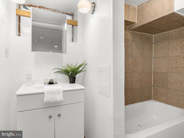 bathroom with a tub to relax in and vanity