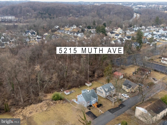 drone / aerial view with a view of trees