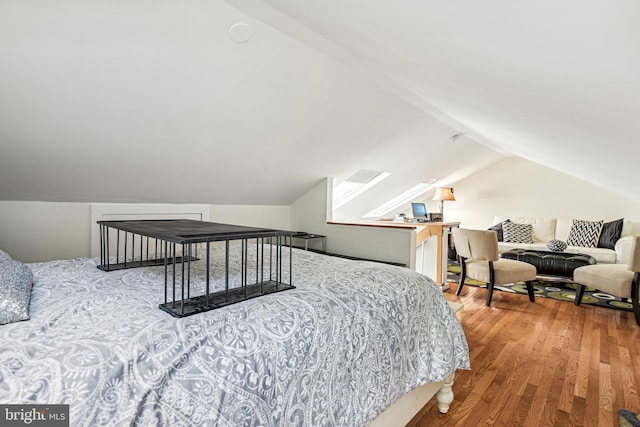 bedroom featuring vaulted ceiling and wood finished floors