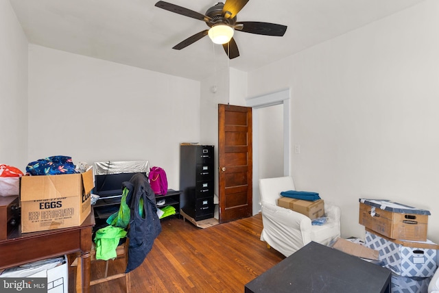 interior space with ceiling fan