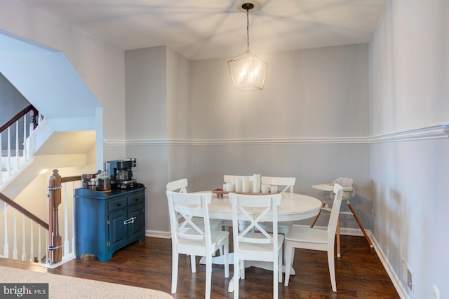 dining area with stairs, dark wood-style flooring, visible vents, and baseboards