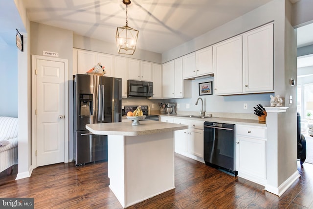 kitchen with electric range, black dishwasher, light countertops, stainless steel fridge with ice dispenser, and decorative light fixtures