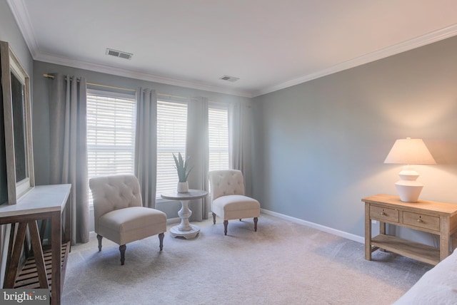 living area with ornamental molding, carpet flooring, visible vents, and baseboards