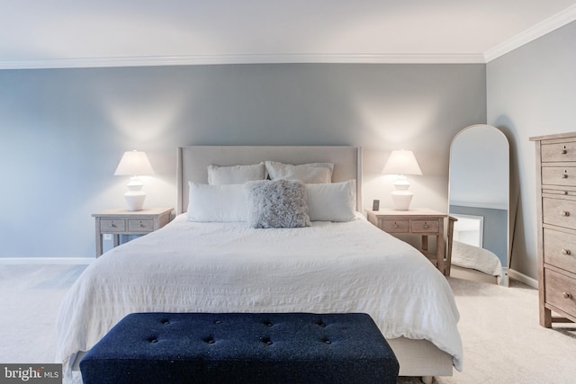 bedroom featuring carpet floors, ornamental molding, and baseboards