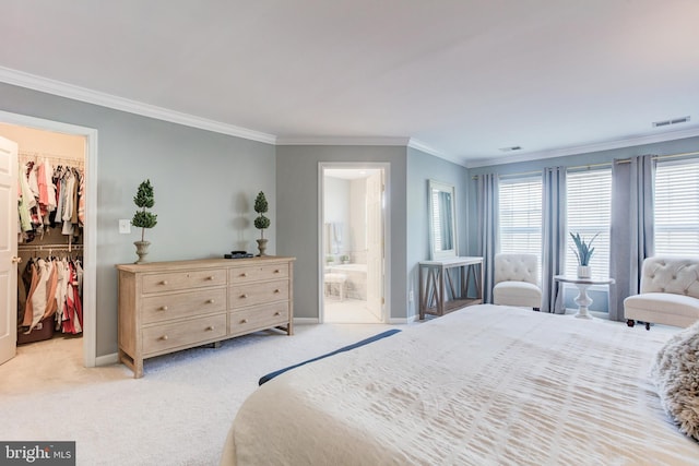 bedroom featuring light colored carpet, visible vents, a spacious closet, a closet, and crown molding