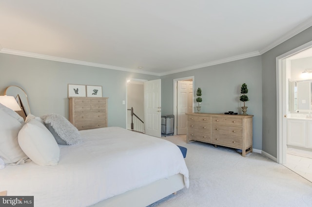 bedroom featuring light carpet, ensuite bath, baseboards, and crown molding