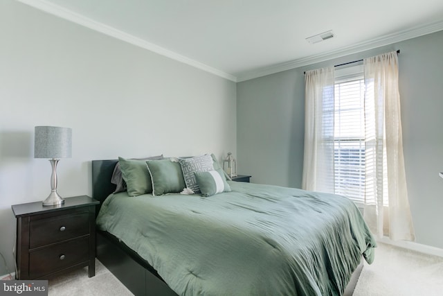 bedroom with visible vents, ornamental molding, and light colored carpet