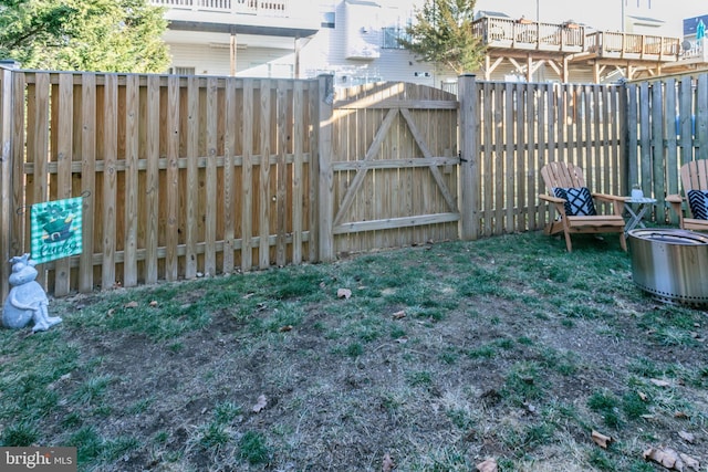 view of yard featuring fence and a gate