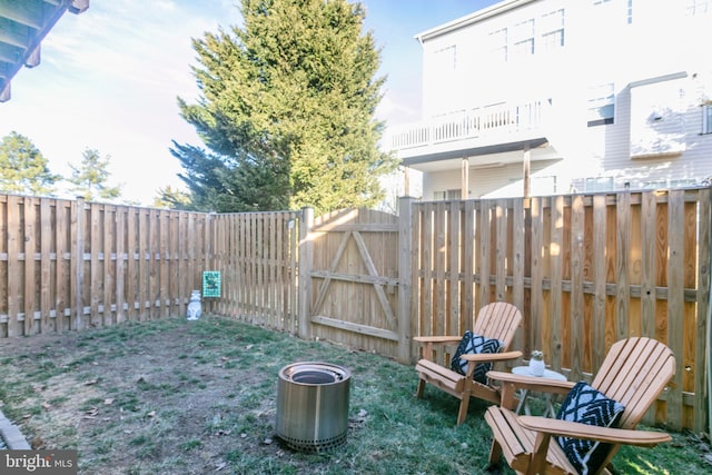 view of yard featuring fence and a gate