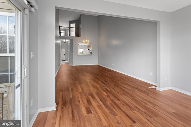 interior space featuring baseboards and wood finished floors