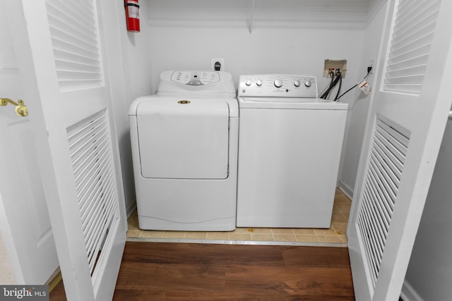 clothes washing area with laundry area and washer and clothes dryer