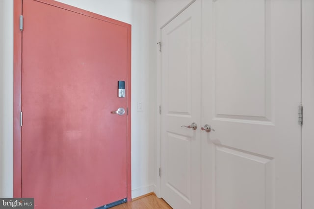 entryway with light wood finished floors