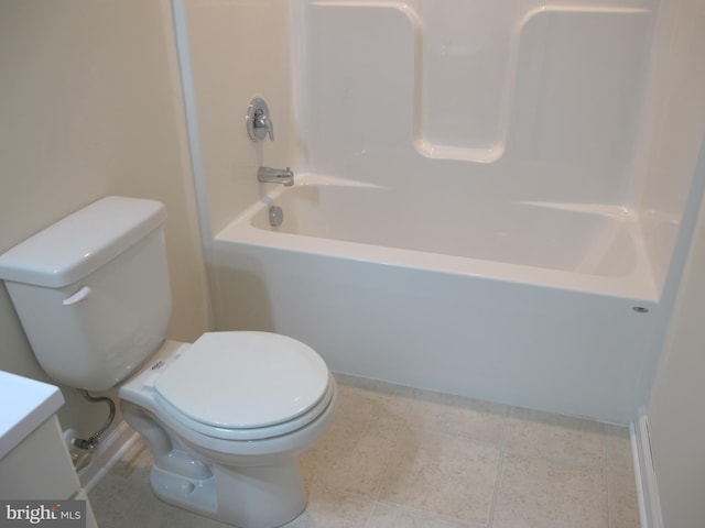 bathroom featuring toilet, tile patterned floors, shower / washtub combination, and vanity