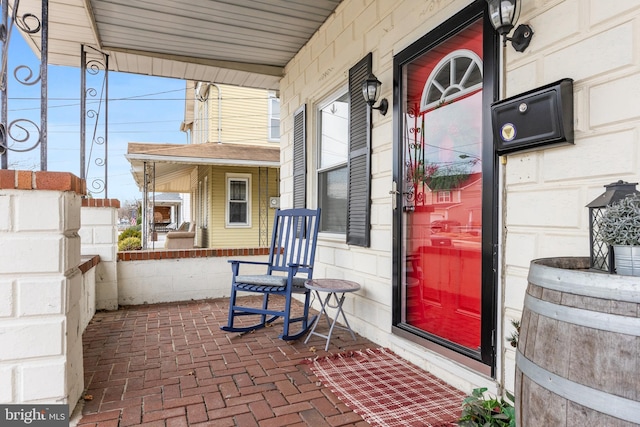 doorway to property featuring covered porch