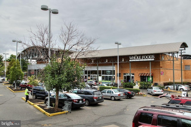 view of building exterior featuring uncovered parking