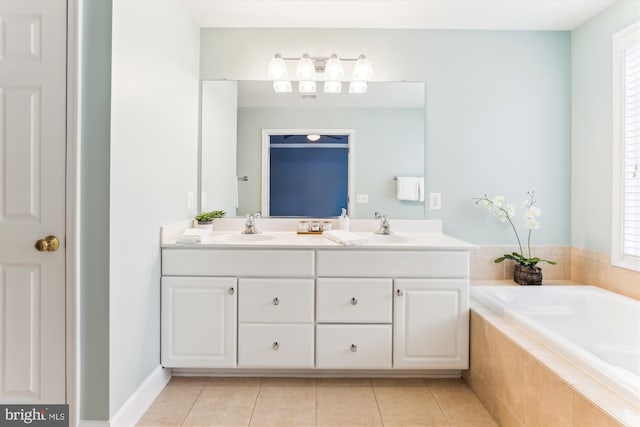 full bathroom featuring a sink, a wealth of natural light, double vanity, and tile patterned floors